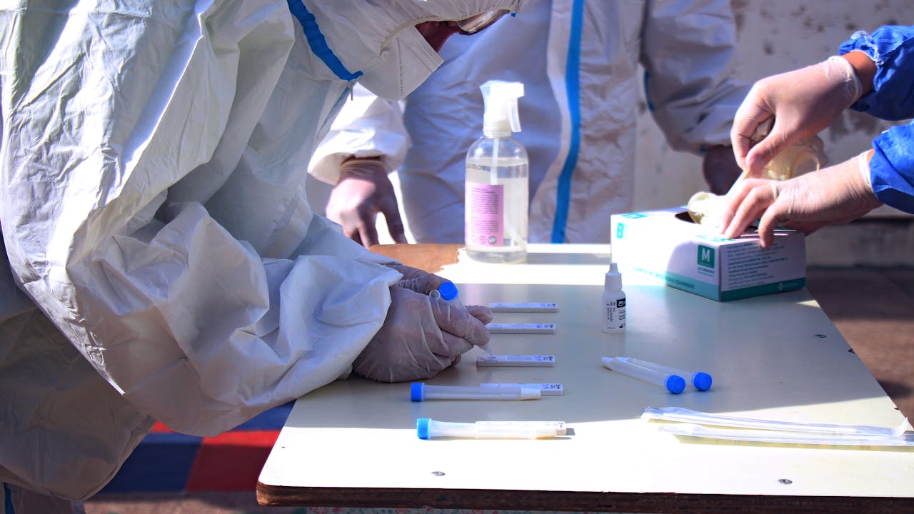 Medical professionals conducting tests in a lab setting.